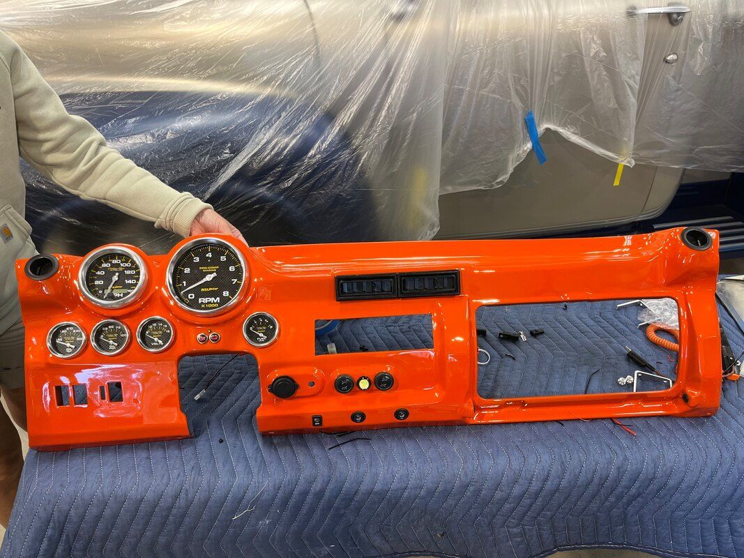 A person is holding an orange dashboard that says new york on it