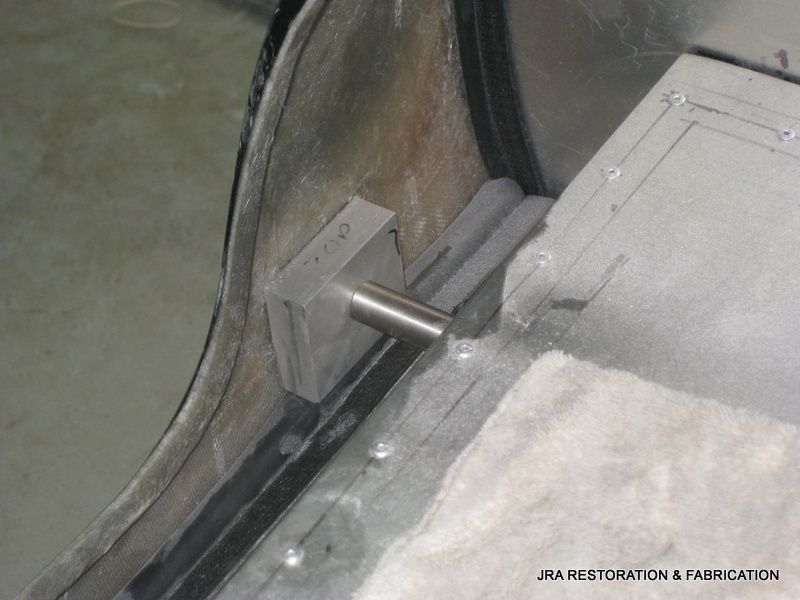 A close up of a piece of metal that says jra restoration & fabrication