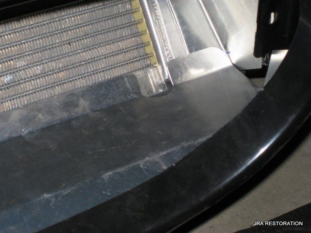 A close up of a bumper with the word jra restoration on the bottom