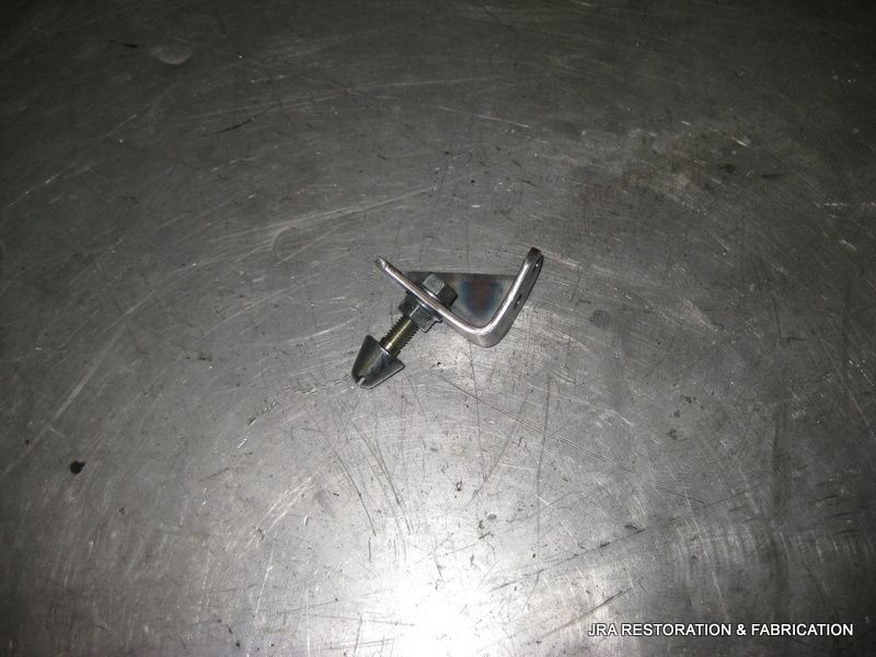 A piece of metal is sitting on a metal surface.