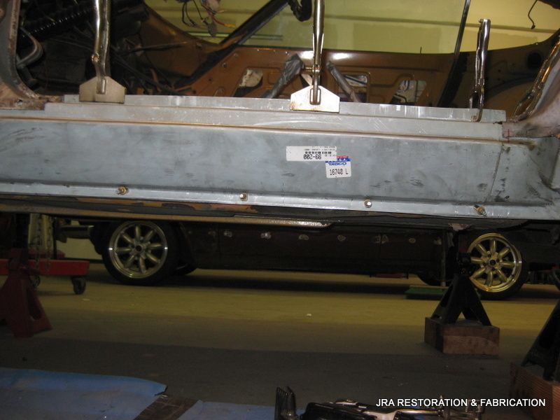 A car is being restored by jra restoration & fabrication