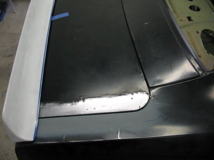 A black car with a white stripe on it