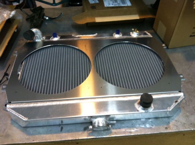 A stainless steel radiator is sitting on a table