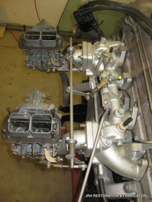 A close up of a carburetor on a car engine