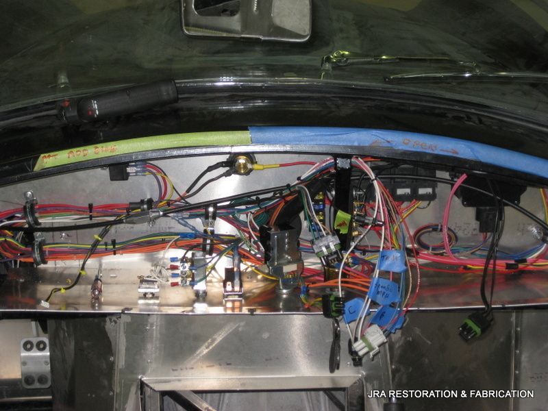 The inside of a car with a lot of wires