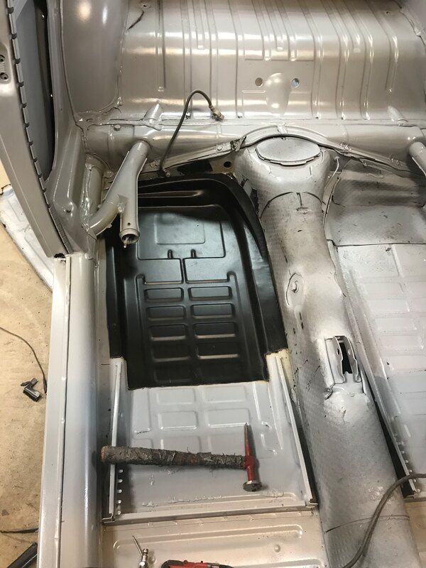 The inside of a car is being worked on.