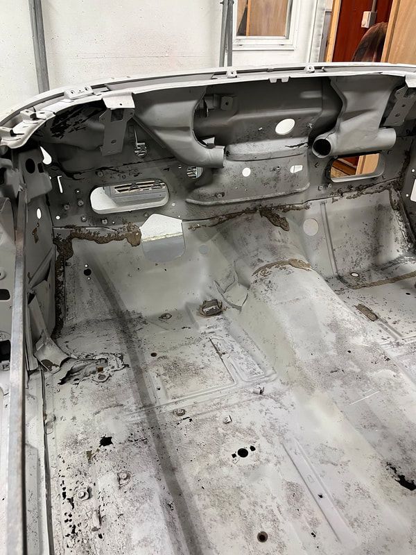 The inside of a car that is being restored.