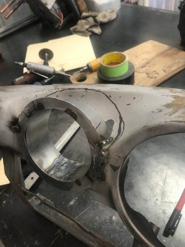 A close up of a piece of metal with a hole in it