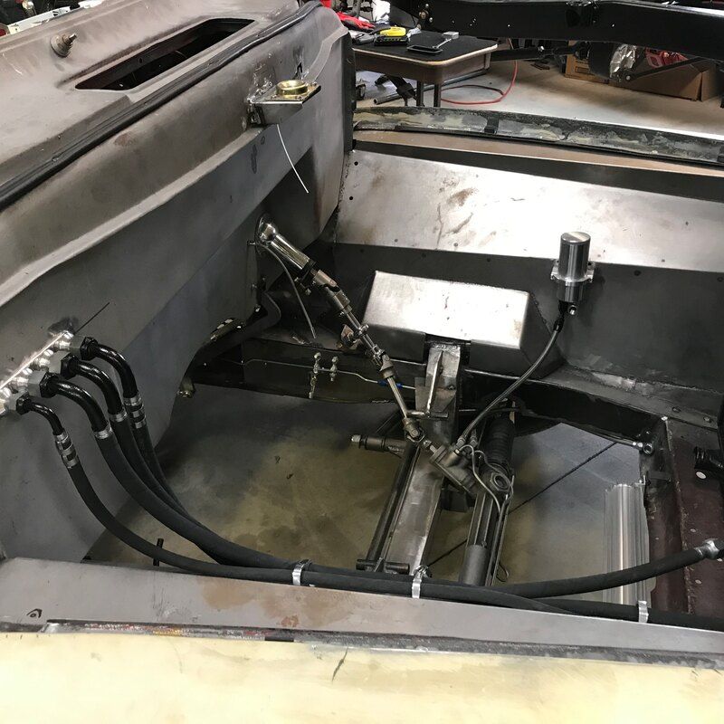 A car with a lot of wires coming out of it