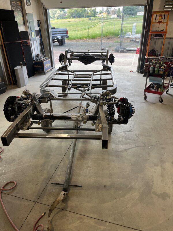 A trailer is being built in a garage.