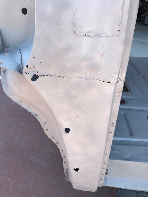 A close up of a piece of white fabric with holes in it