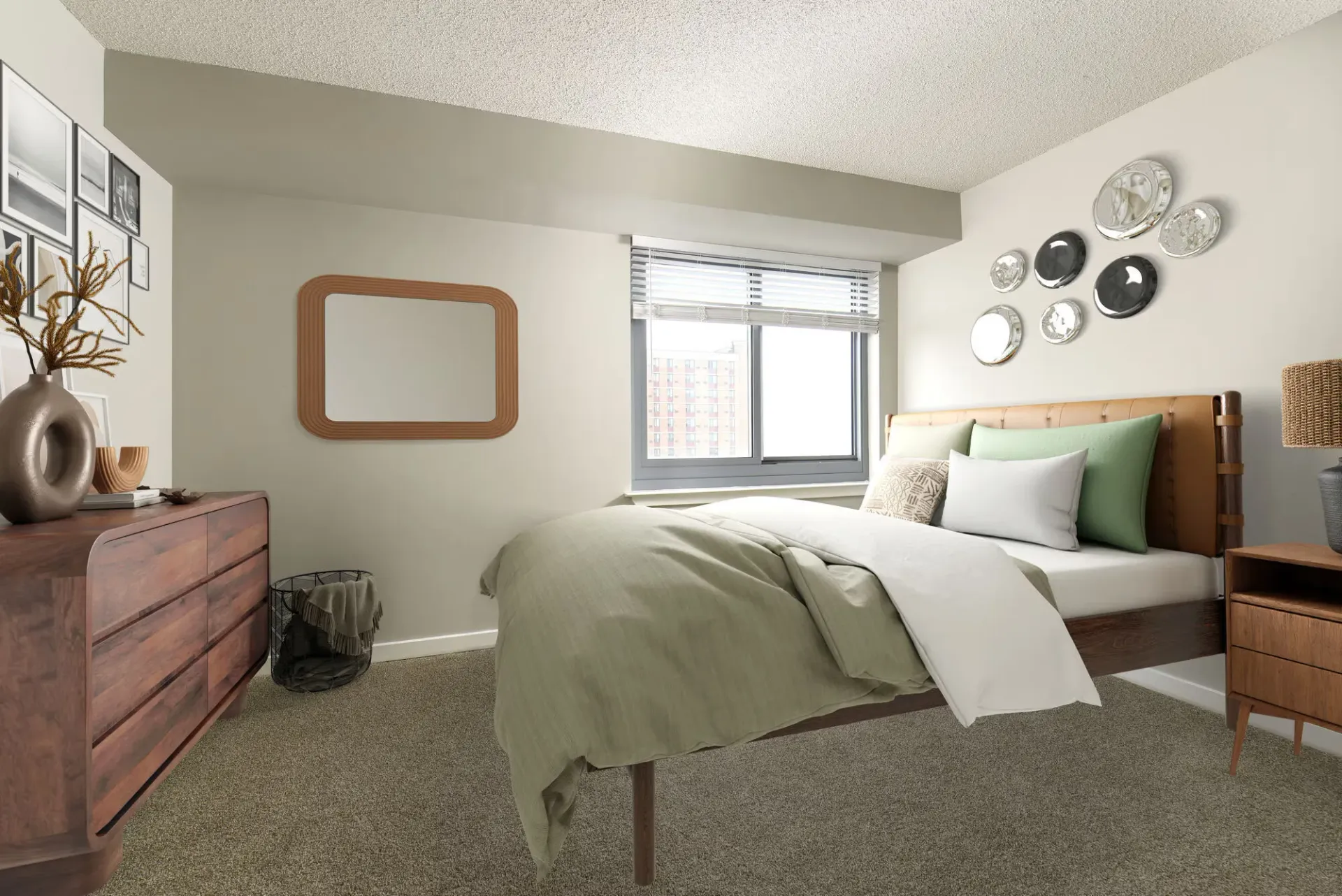 Bedroom with bed, wooden dresser, rectangular wall mirror, and a window with blinds.