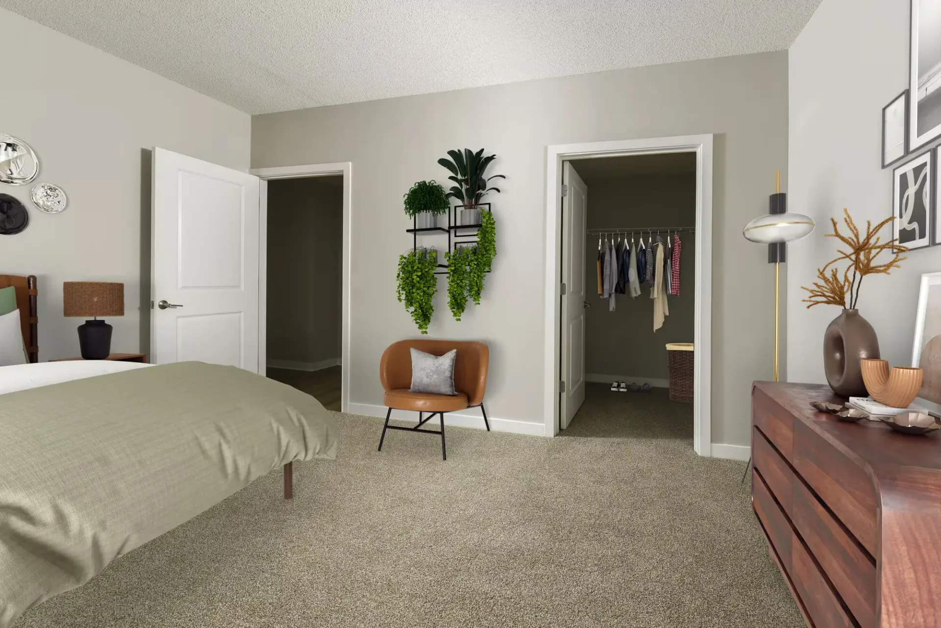 Bedroom in a modern apartment featuring a bed, dresser, open closet, and a small chair.