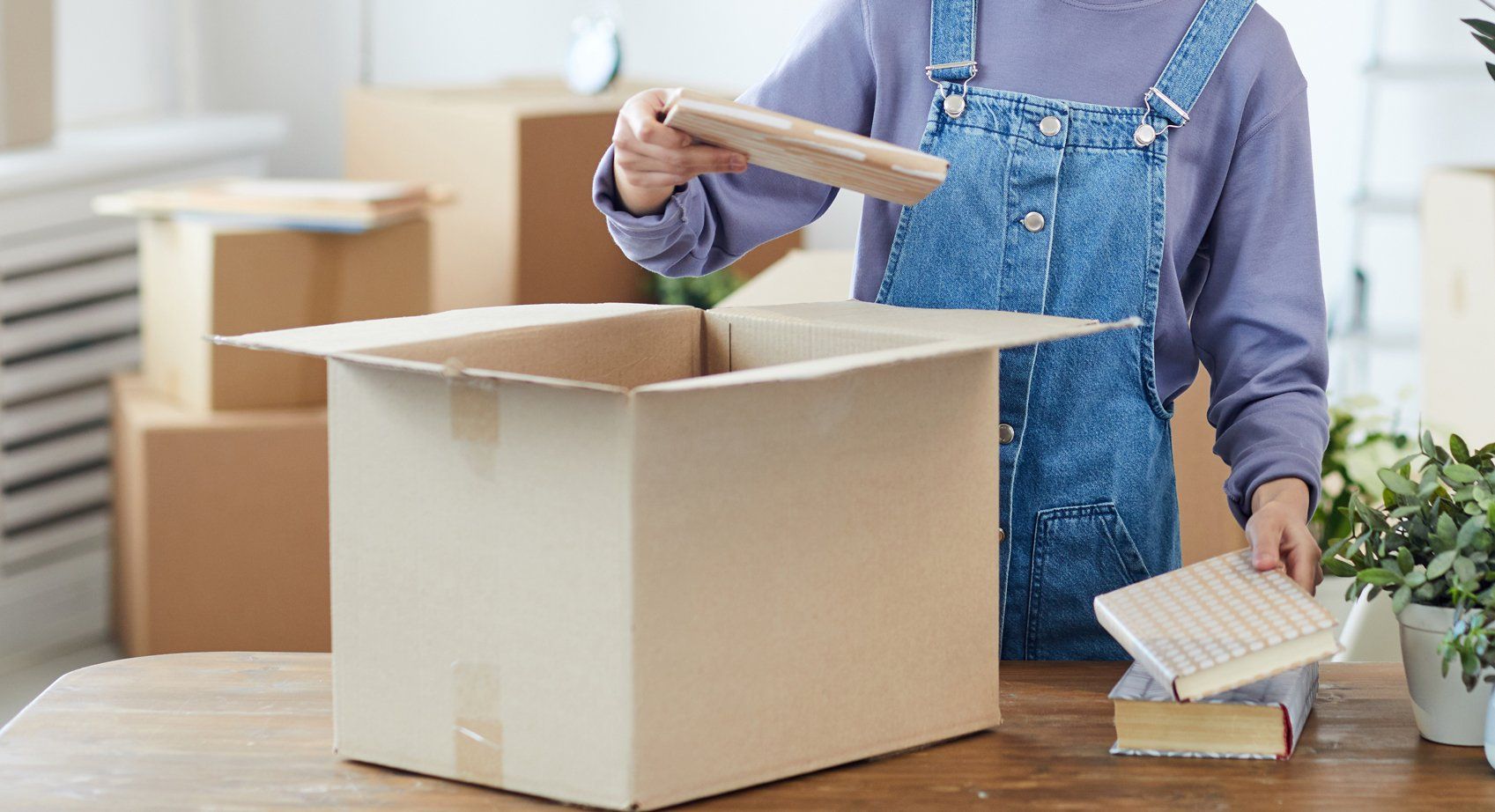 Man Unpacking Cardboard Box — Pittsburgh, PA — The Nature Maid