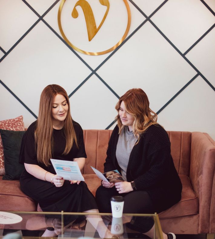 There is a massage table in the middle of the room.