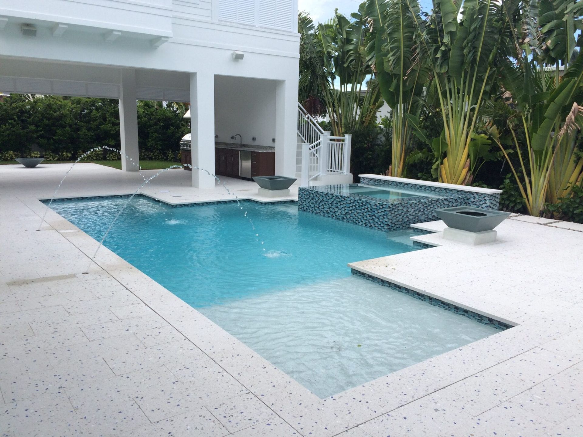 A large swimming pool in the backyard of a house