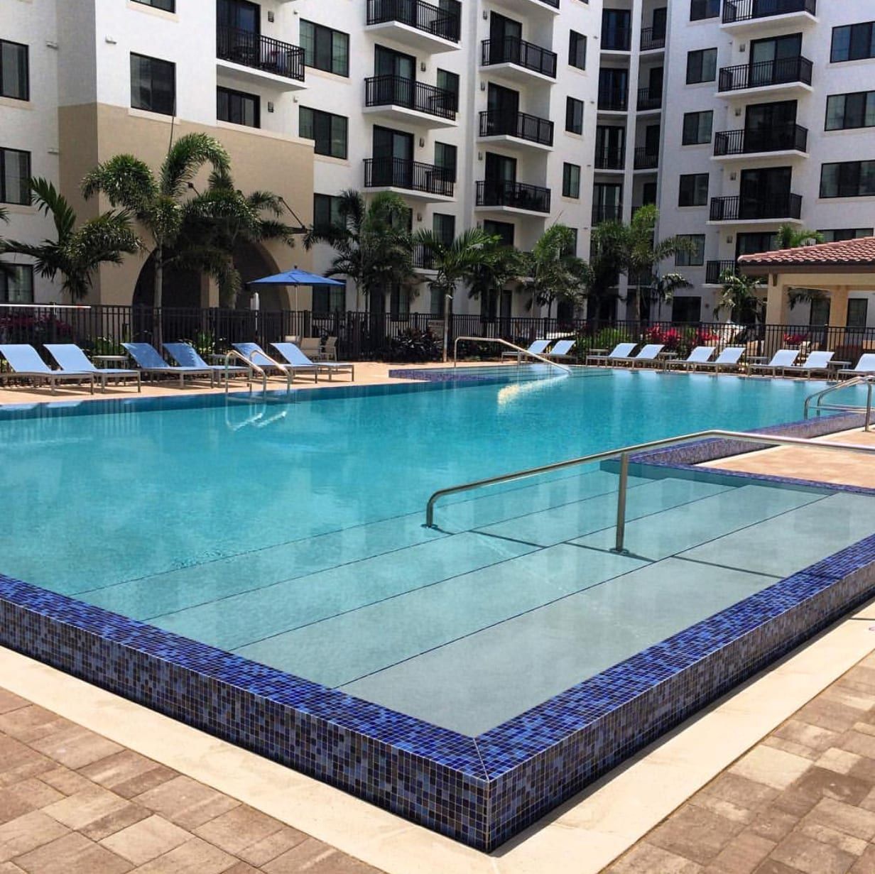 A large swimming pool in front of a building