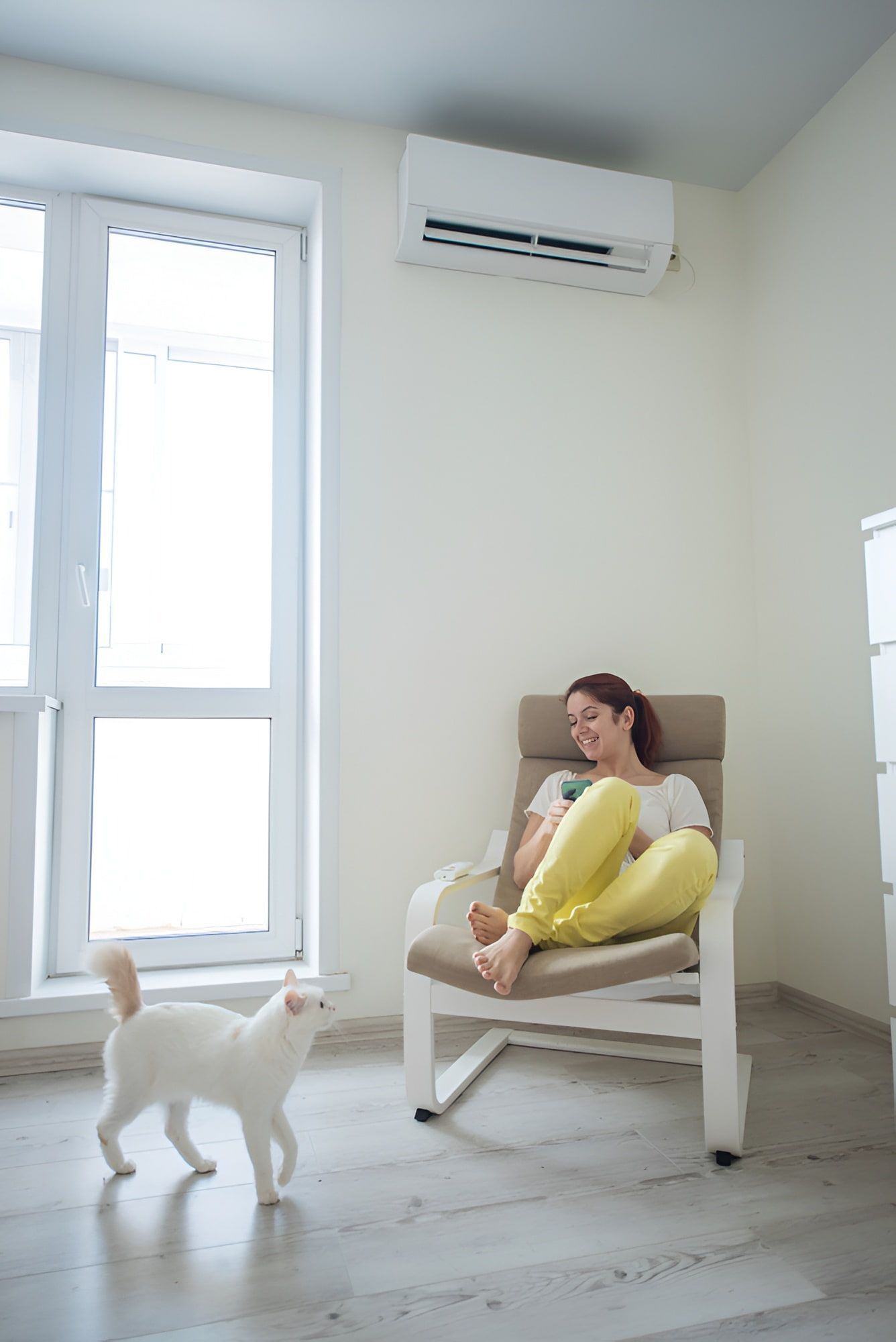 A Modern Bright Room with an AC Unit on the Wall — Frosty Solutions Air Conditioning In Lithgow, NSW