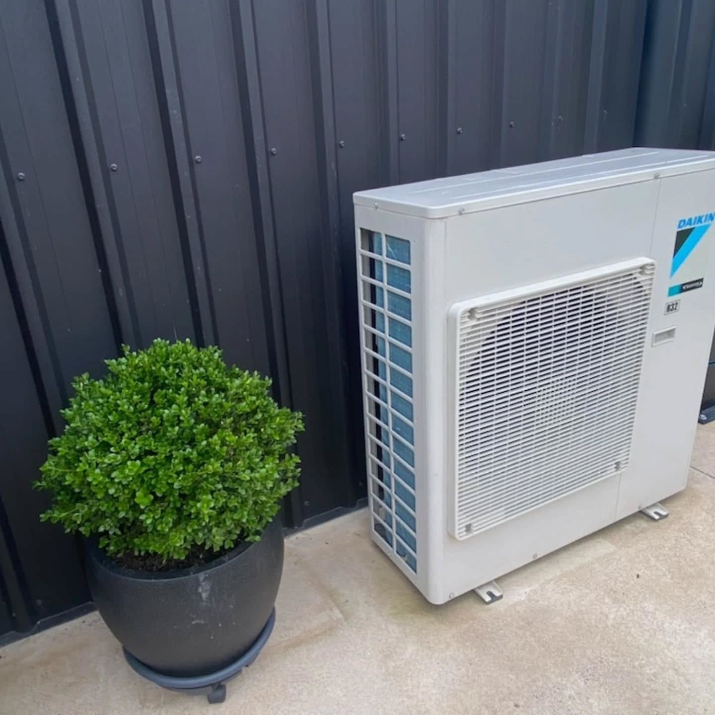White Air Conditioning Unit Mounted on a Wall — Frosty Solutions Air Conditioning In Mudgee, NSW