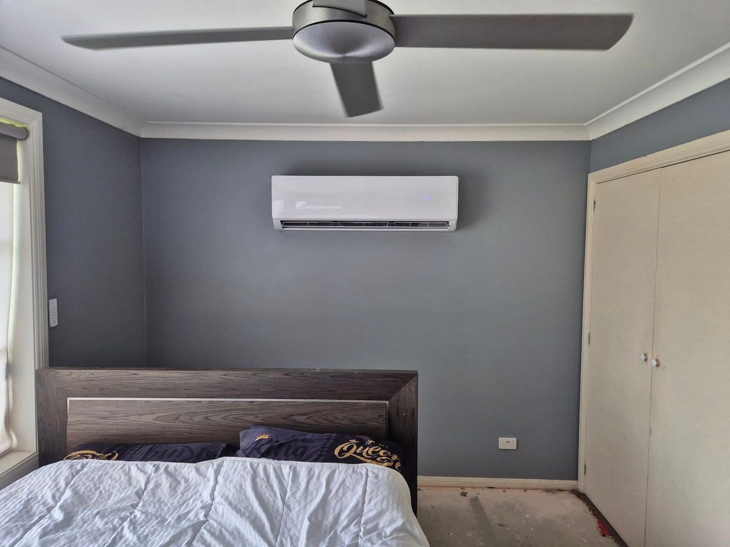 Bedroom With a Bed, Air Conditioner, Ceiling Fan, and a Closet — Frosty Solutions Air Conditioning In Mudgee, NSW