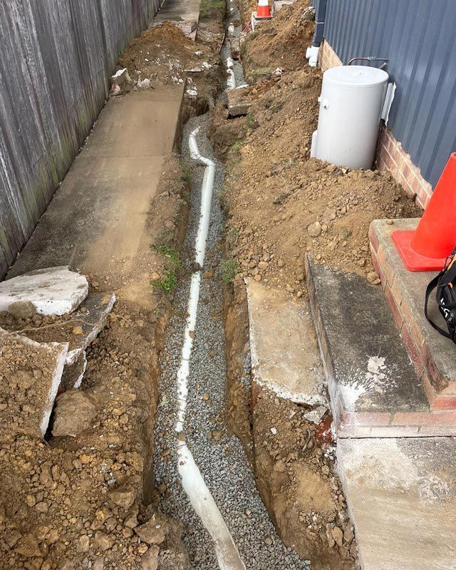 Underground Pipe Plumbing Service With Two Stairs On Right — Bridge Plumbing & Trades in Nowra, NSW