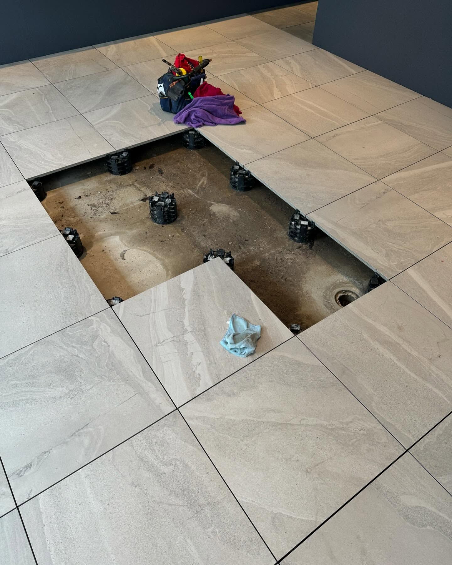 Floor Tiles With a Section Removed — Bridge Plumbing & Trades In Jervis Bay, NSW