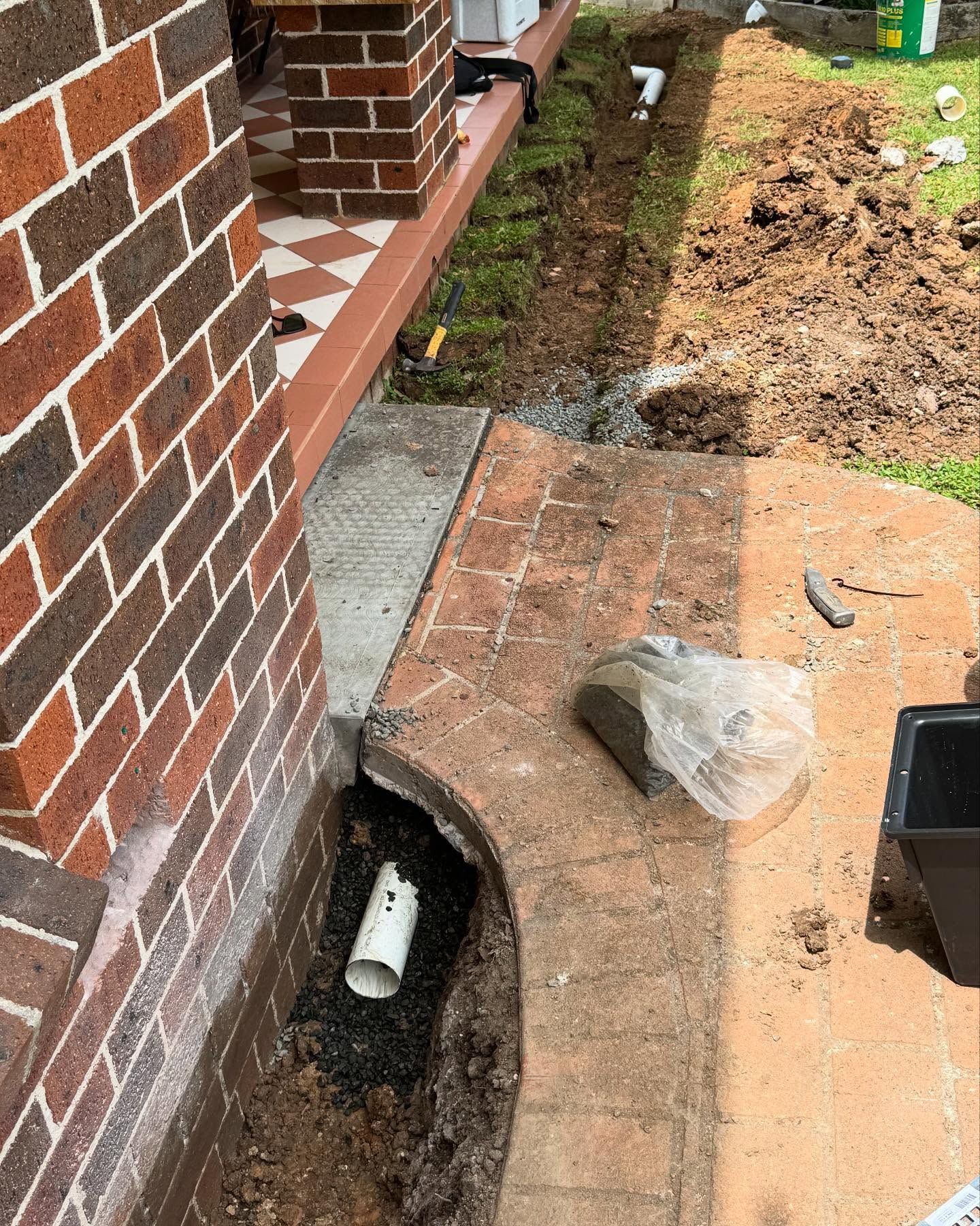 Trench With White Pipe Visible — Bridge Plumbing & Trades In Kiama, NSW