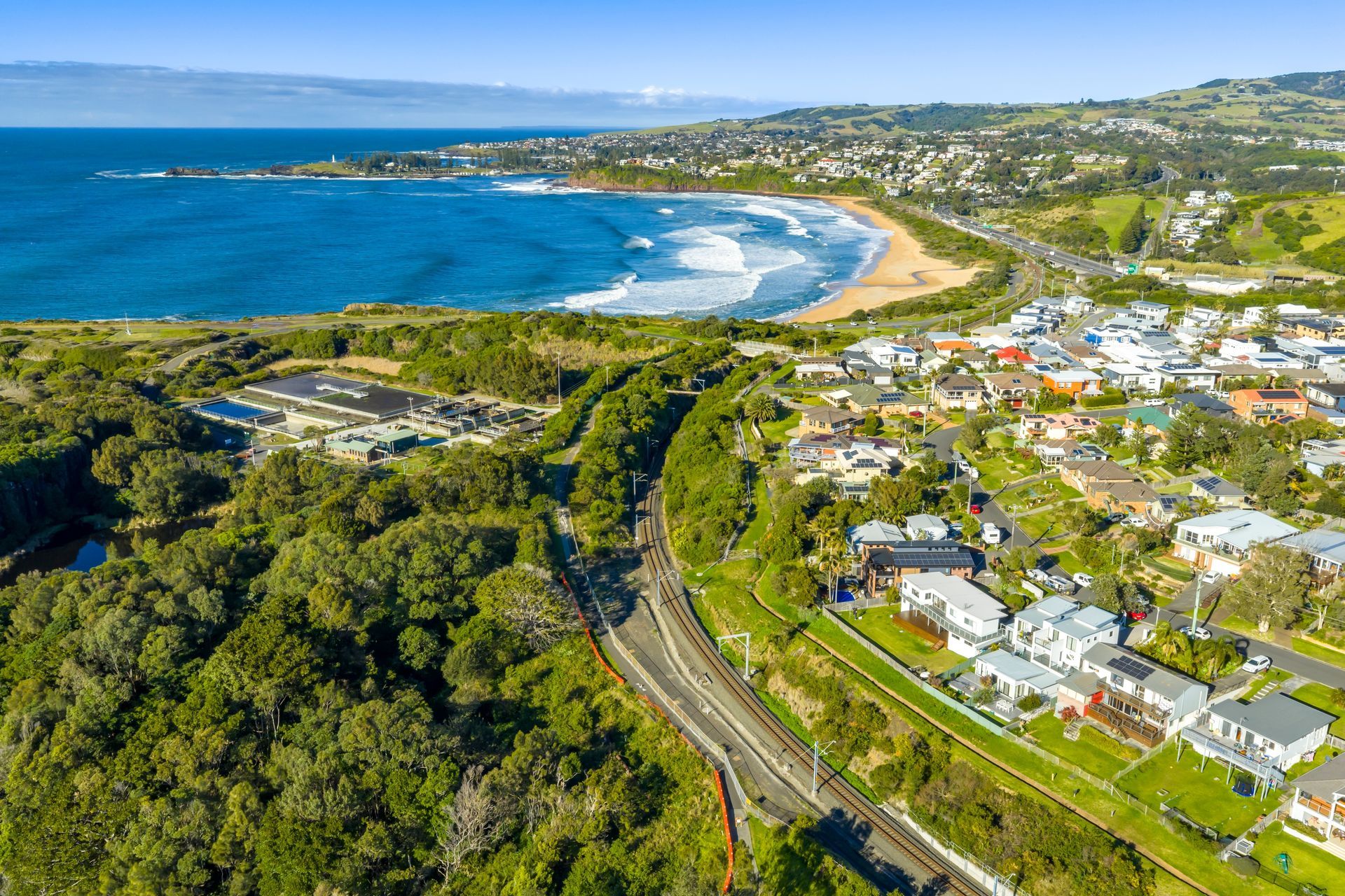 Coastal Town With Beach, Buildings, and Green Hills — Bridge Plumbing & Trades In Kiama, NSW