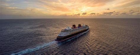 Cruise ship sailing at sunset on a calm open ocean