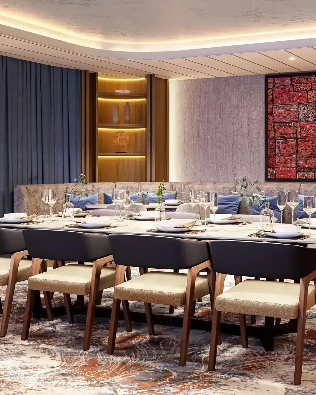 A dining room with a long table and chairs.