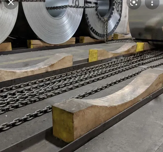 A bunch of metal rolls stacked on top of each other