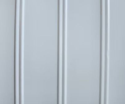 White vertical paneling with rounded grooves.