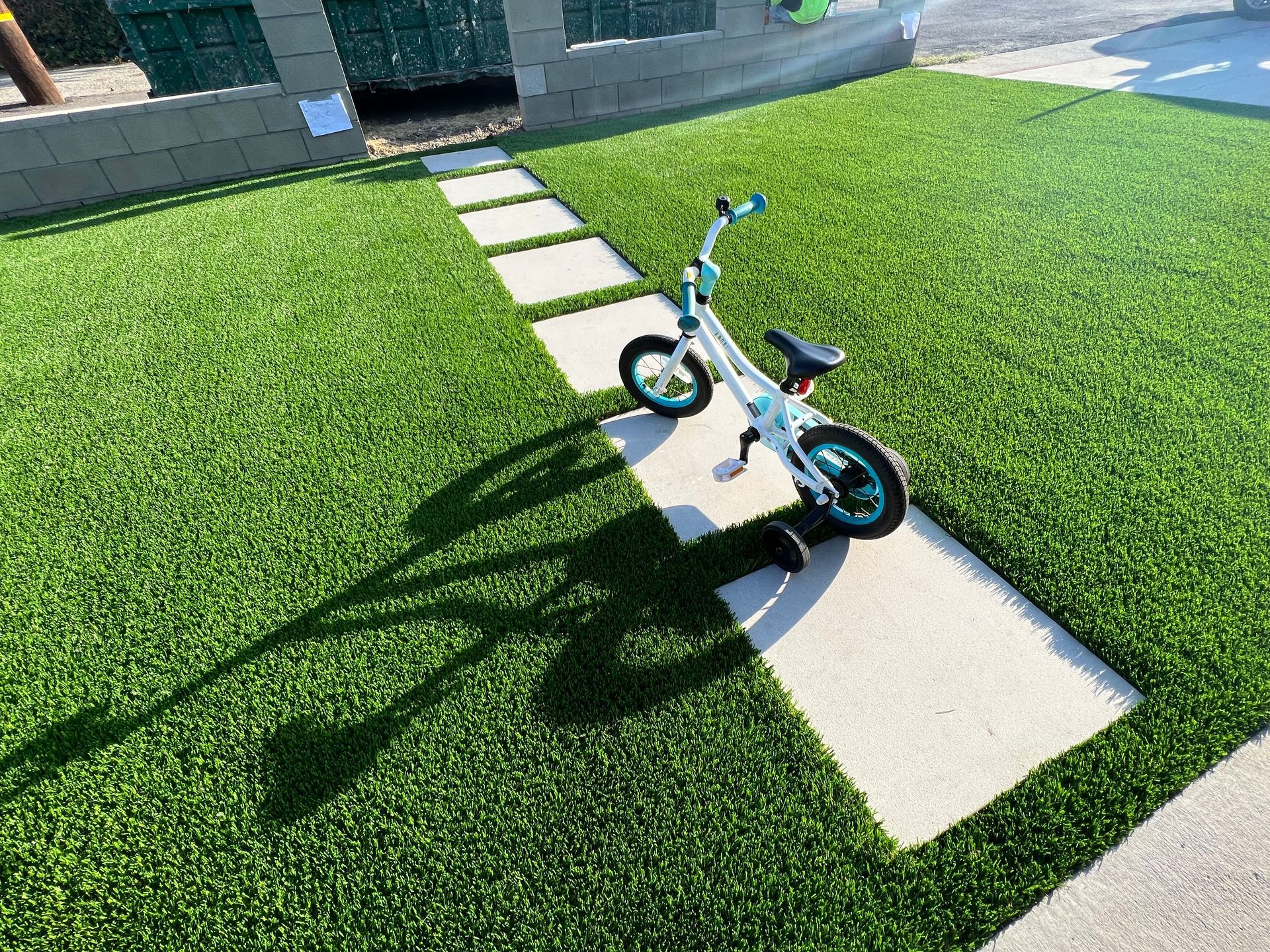 step stone and fake grass