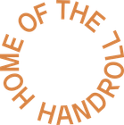 A logo that says home of the handroll in a circle