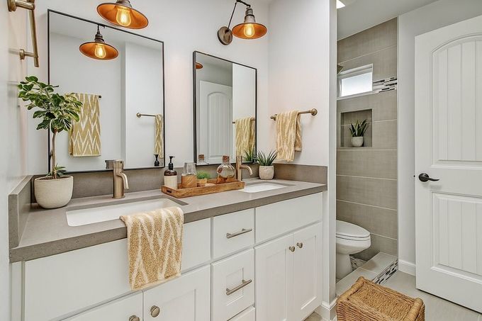 A bathroom with a toilet a tub and a window