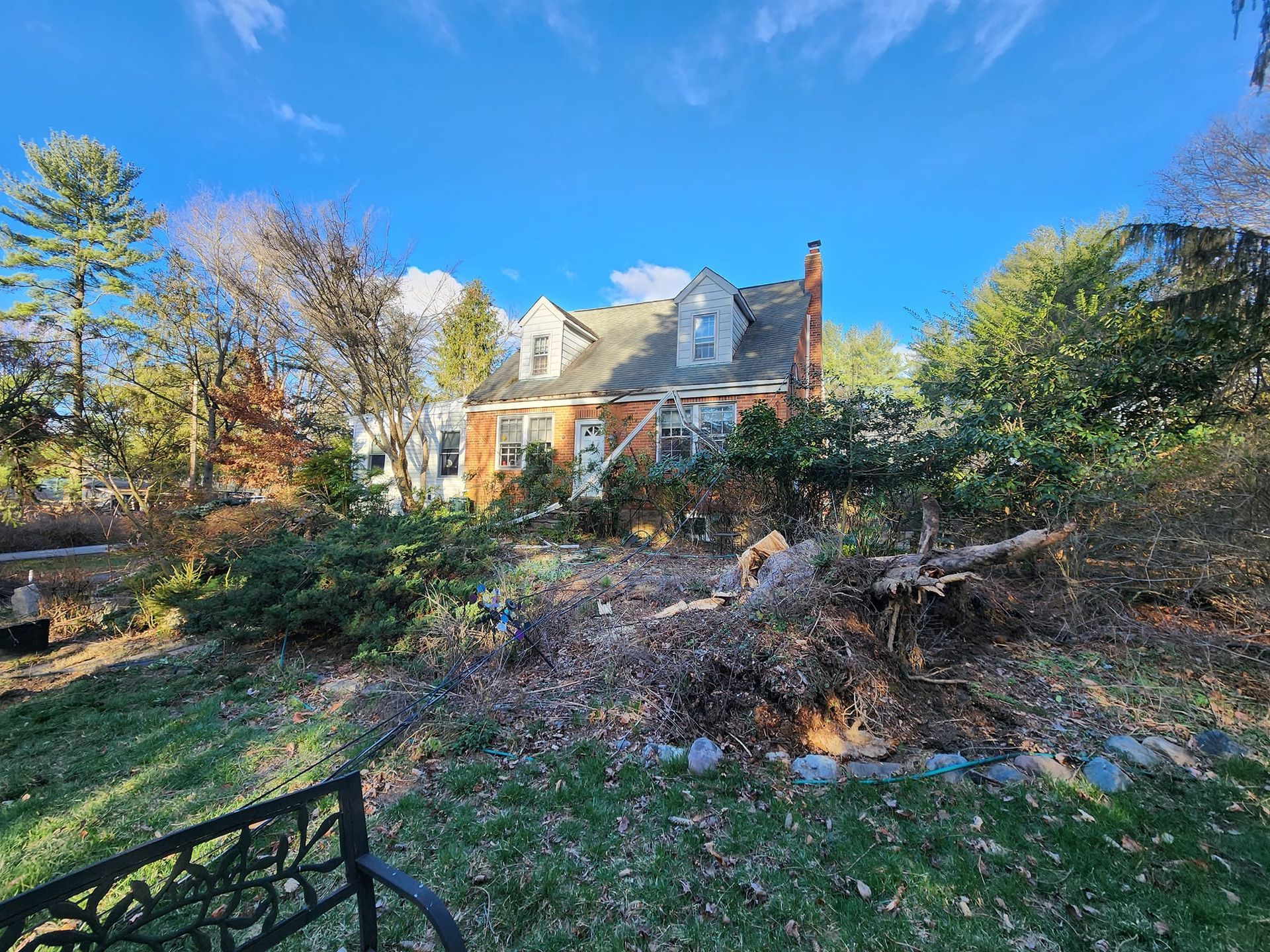 A large house with a lot of trees in front of it.