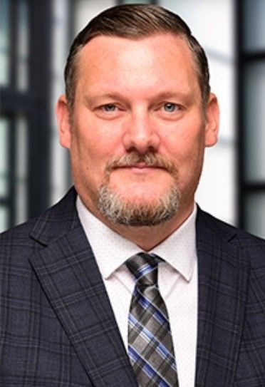 A silhouette of a man without a face on a white background.