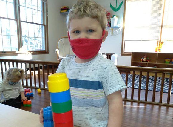 Toddler and Teacher Playing with Construction Blocks — Alton IL — Toddle Towne Learning Center