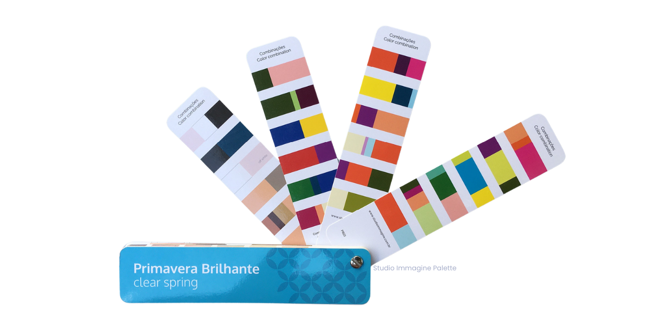 A bunch of colorful cards are stacked on top of each other on a white background.