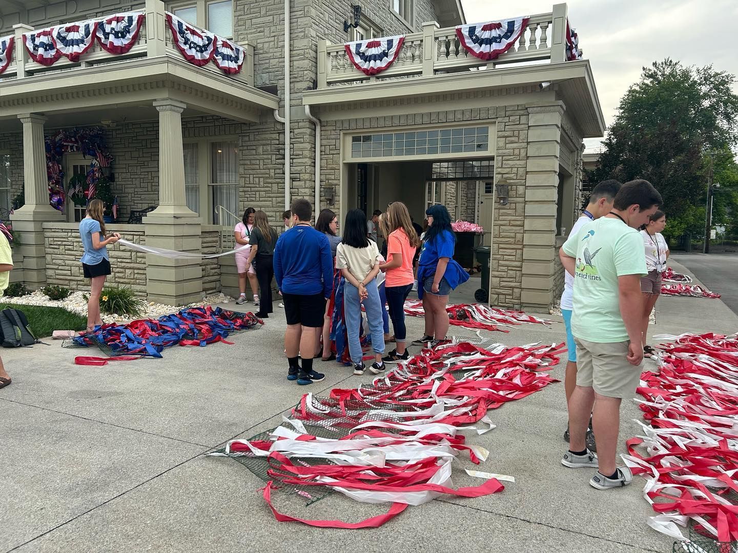 Rogers Explorers working on red, white, and blue decorations.