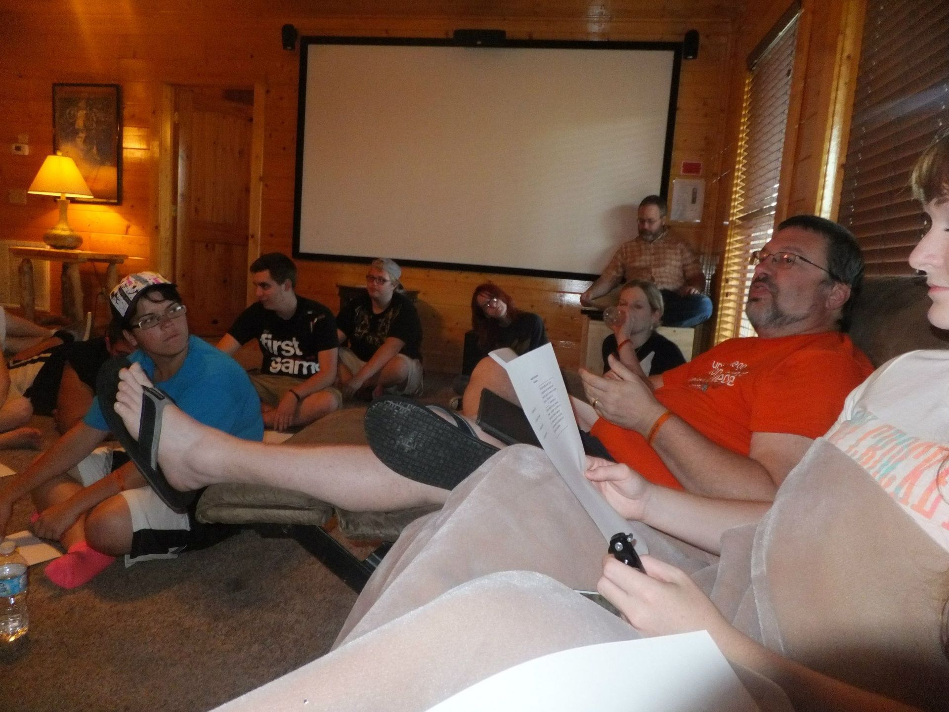 Miller sitting in a circle with students and faculty, having a discussion.