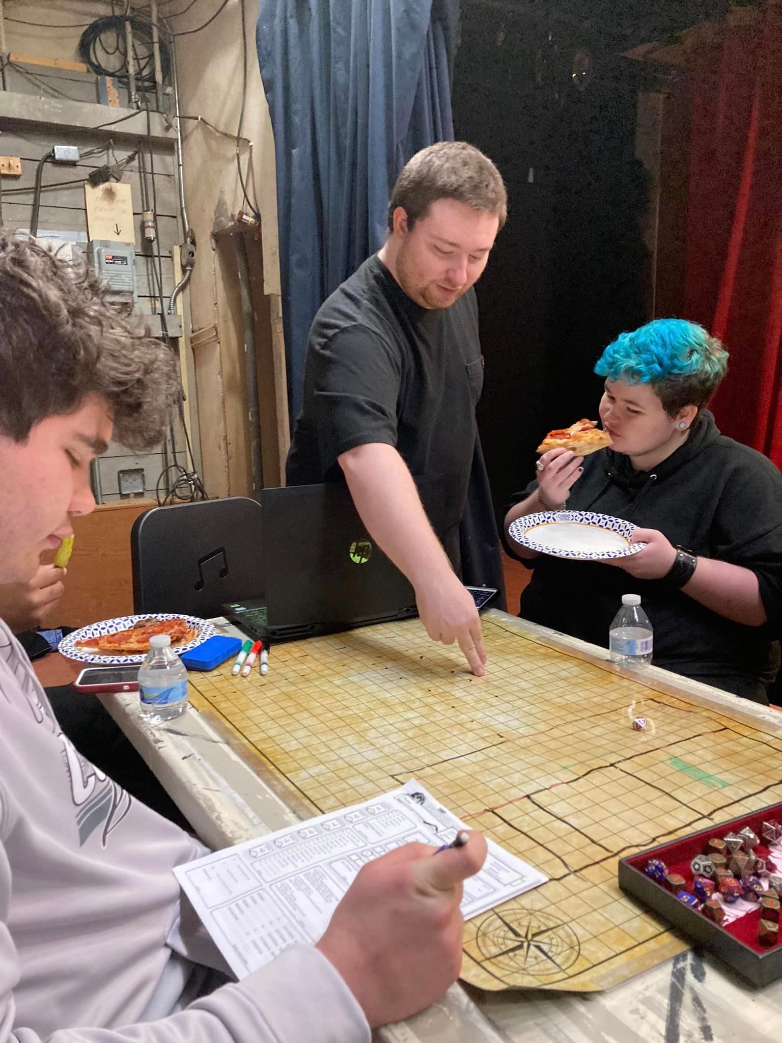 Cast & crew learning about Dungeons and Dragons from Social Players Club President David Cody Saylor.