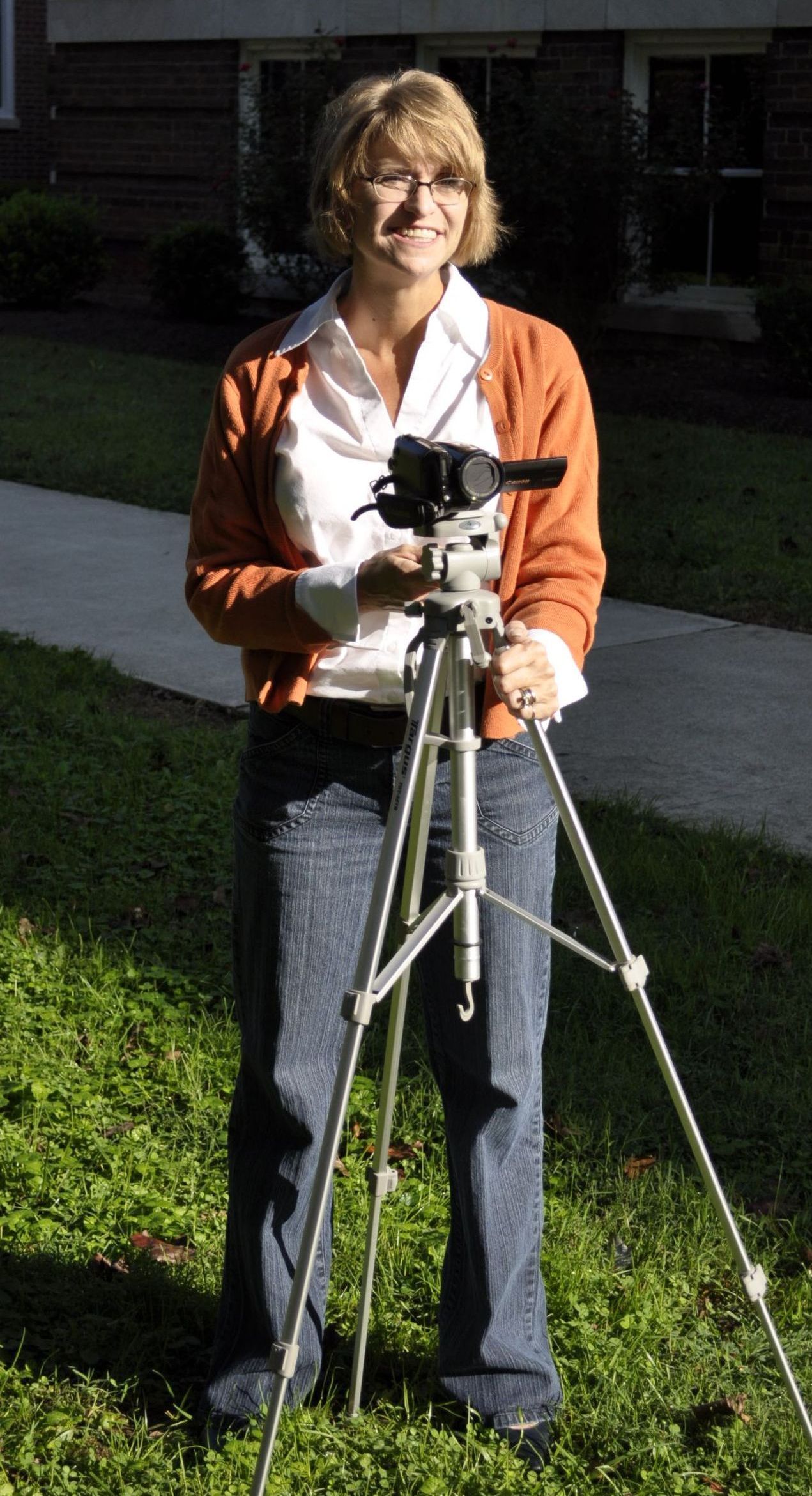 Dr. Christine Marley-Frederick holding a mounted camera.
