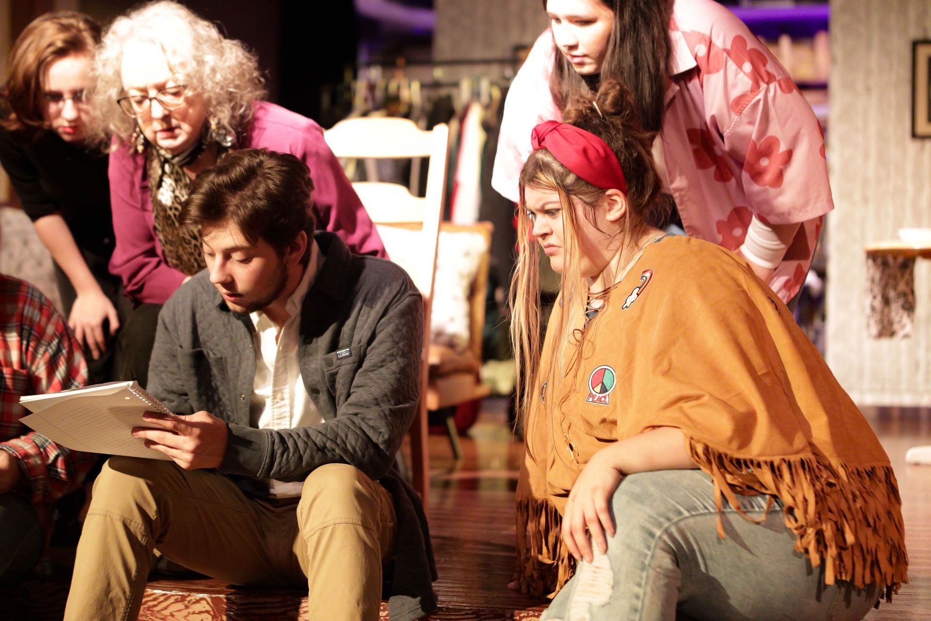 The theatre troupe gathered around their director Dave.