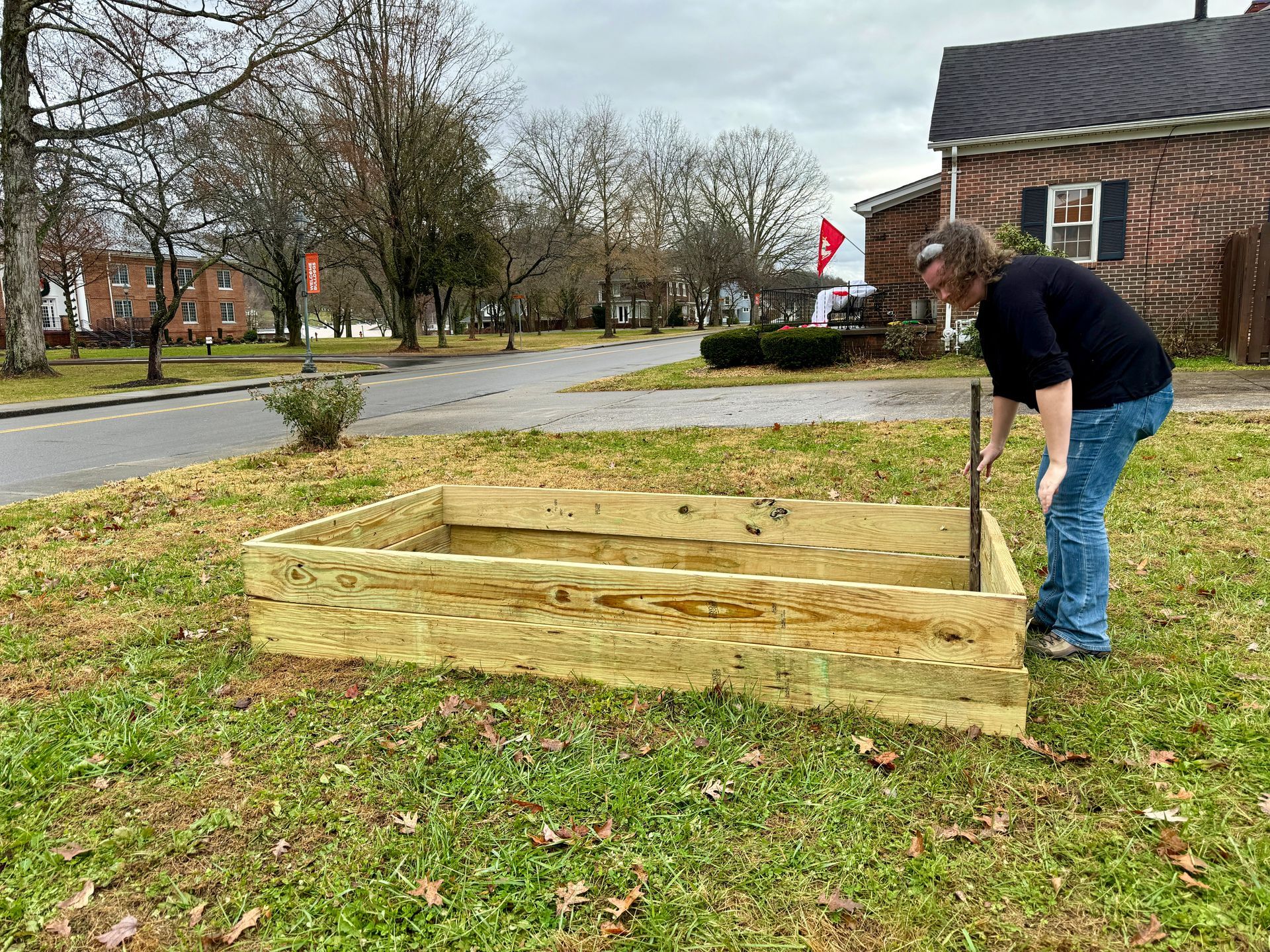 Libby Megna testing a garden bed.