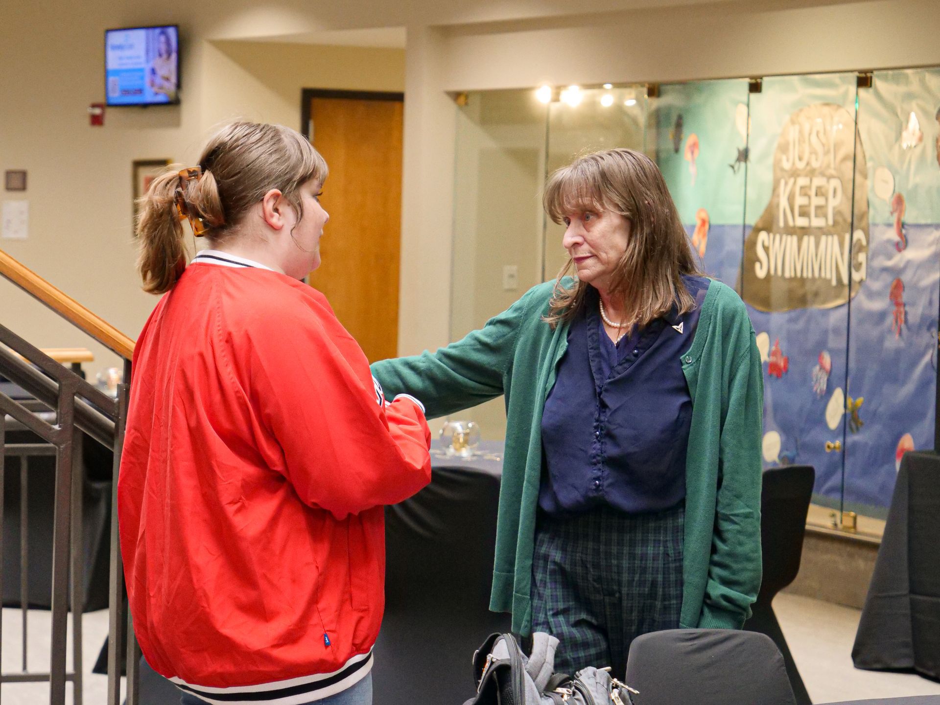 Dr. Christine Marley-Frederick talking to a retirement party attendee.