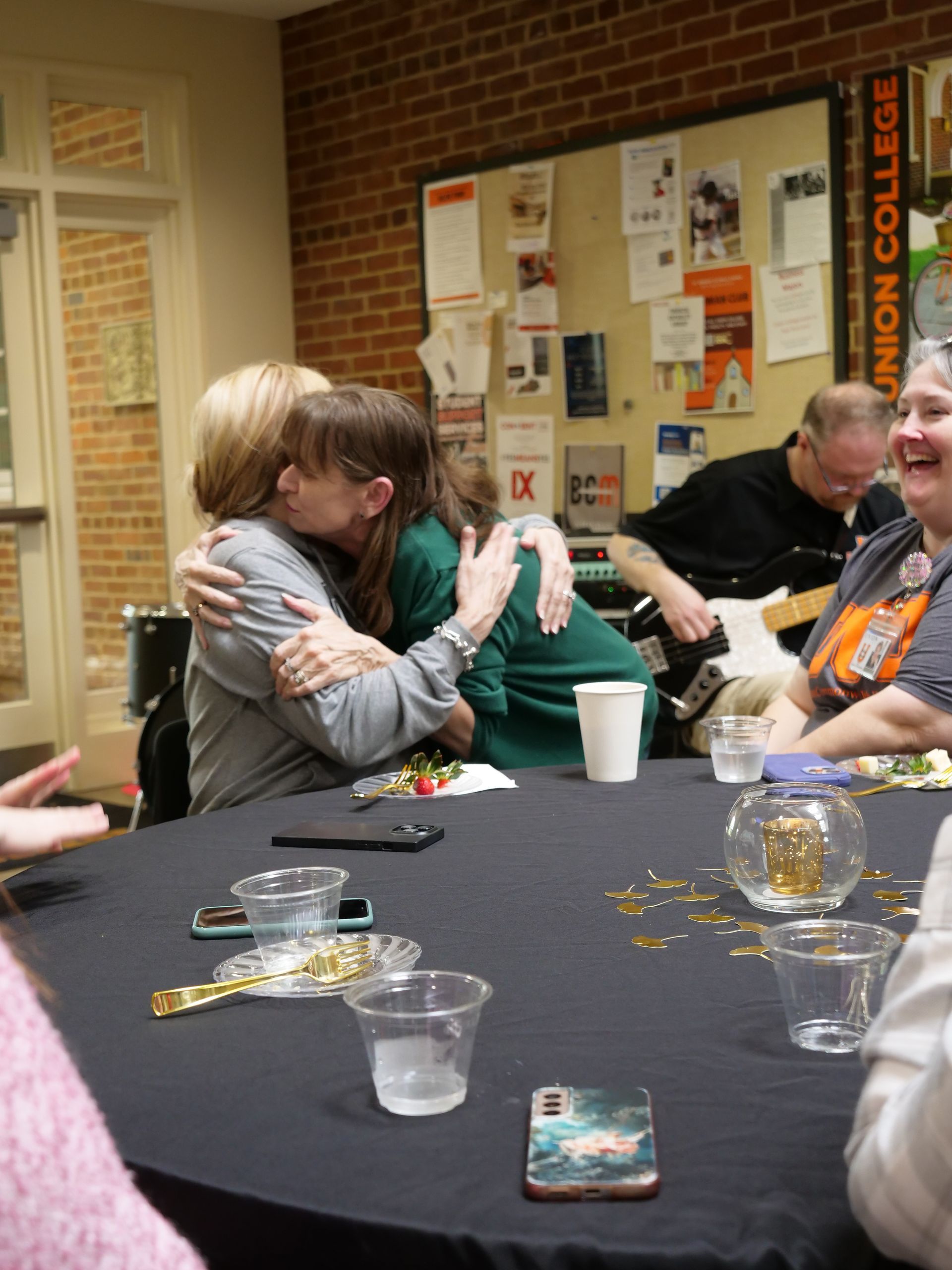 Dr. Christine Marley-Frederick hugging a faculty member.
