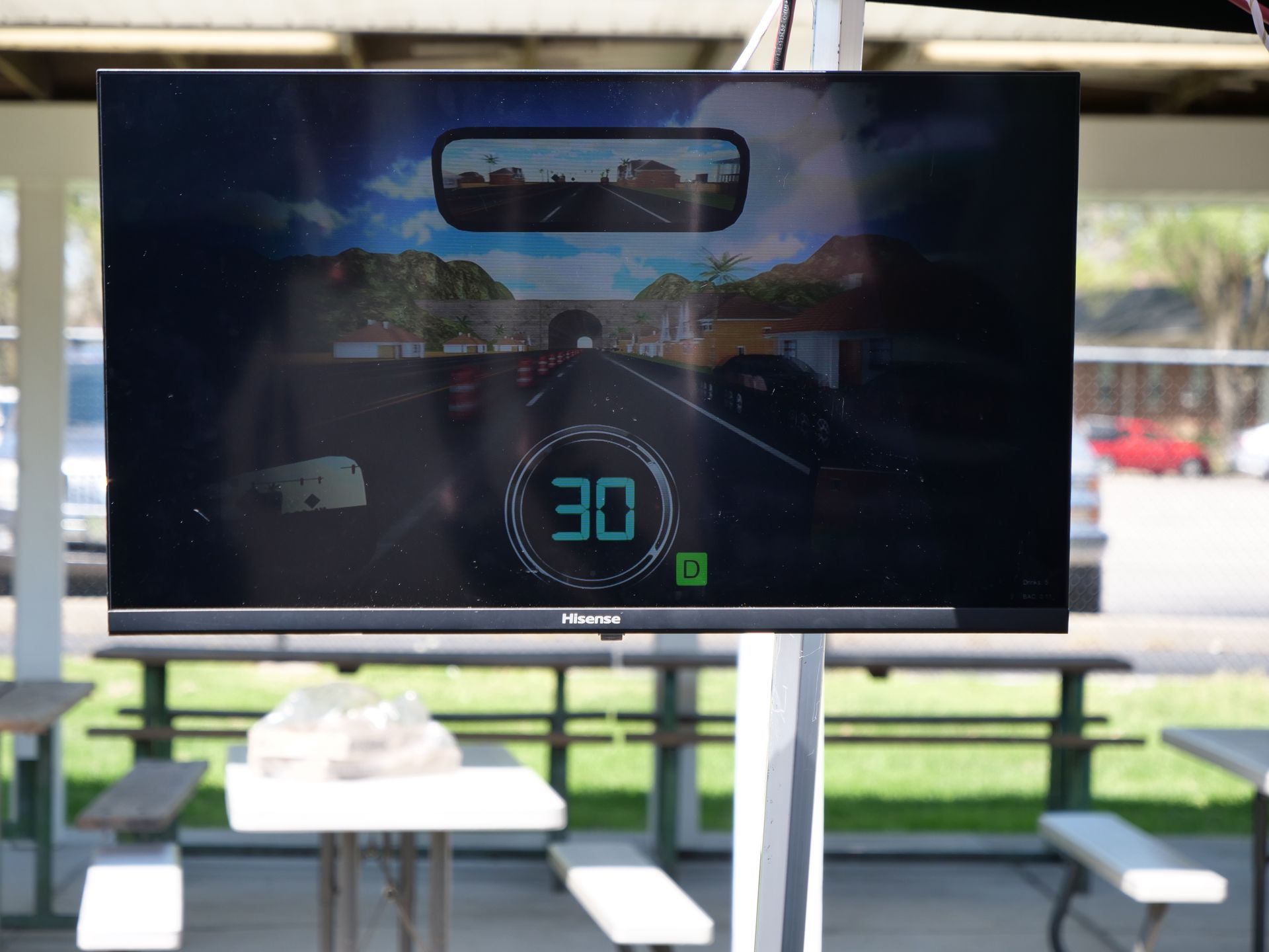 A projector showing the simulated driving experience of the Arrive Alive Tour.