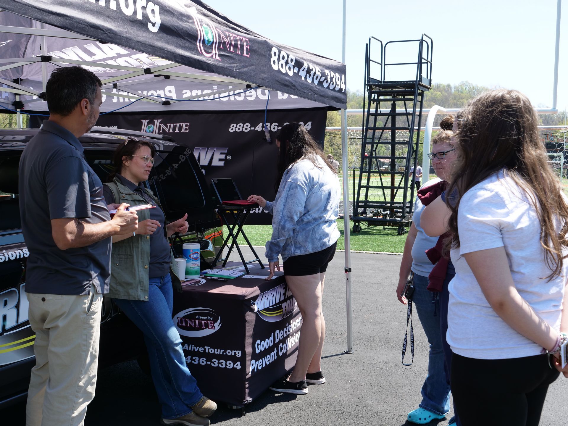 Students talking to members of the Arrive Alive Tour.