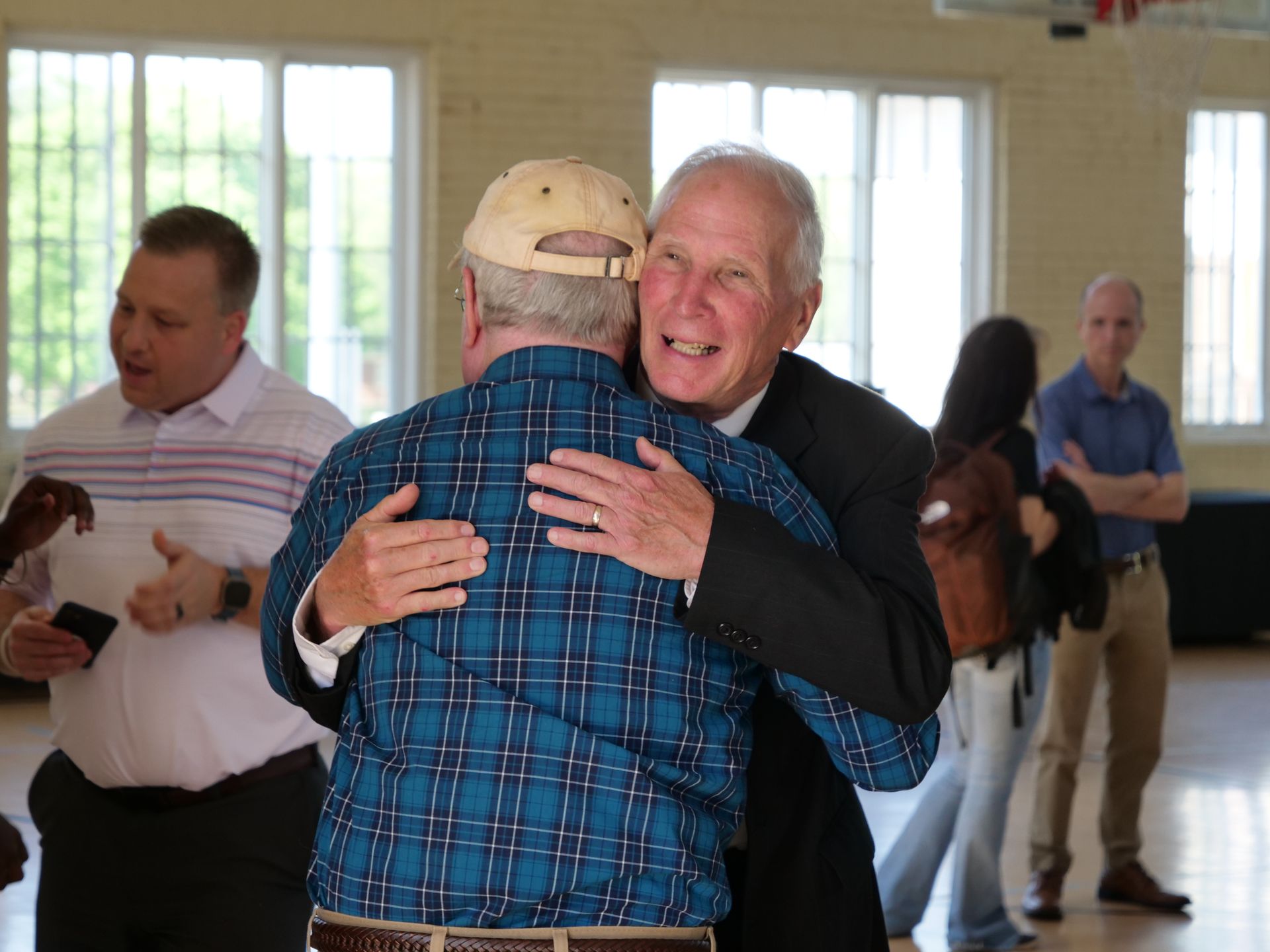 Dr. Inkster hugging a retirement party attendee.